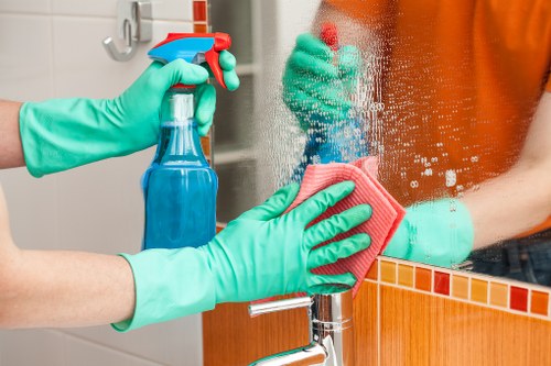 Carpet cleaning team preparing equipment safely indoors